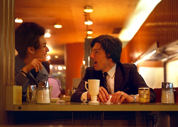 people talking at cafe in 1970