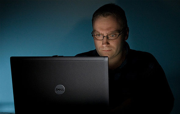 freelance laptop guy in the dark