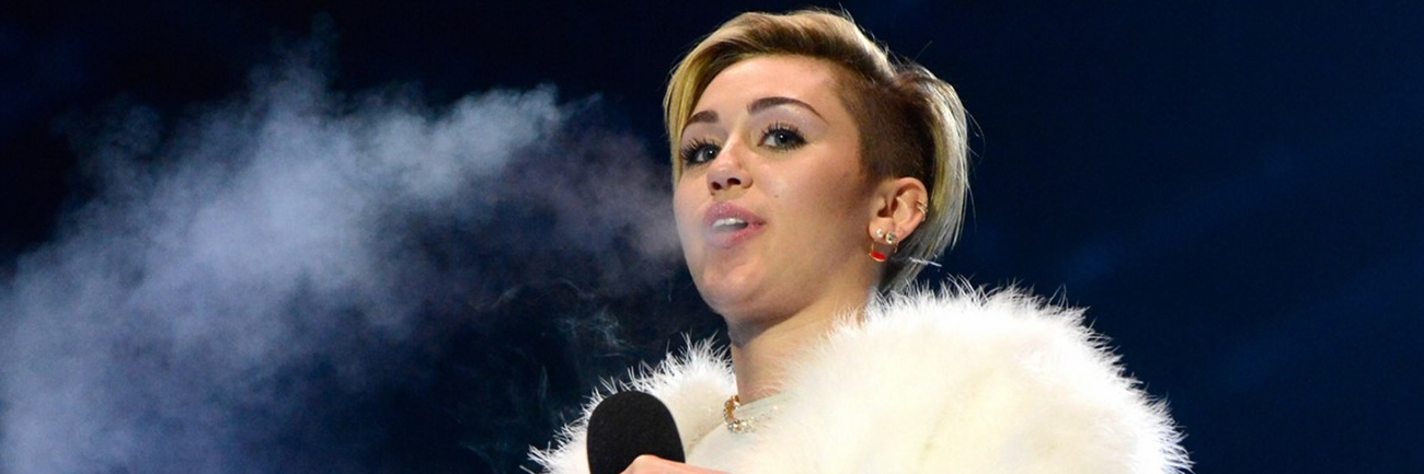 Miley Cyrus Dances with a Dwarf and Smokes a Joint During the MTV EMAs Miley Cyrus Dances with a Dwarf and Smokes a Joint During the MTV EMAs